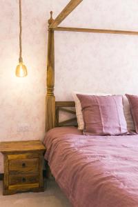 Postel nebo postele na pokoji v ubytování Maison d'hôtes le Prieuré du Preux