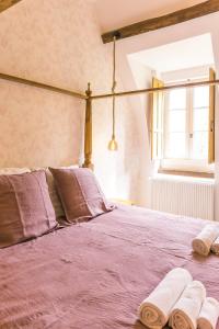 Postel nebo postele na pokoji v ubytování Maison d'hôtes le Prieuré du Preux