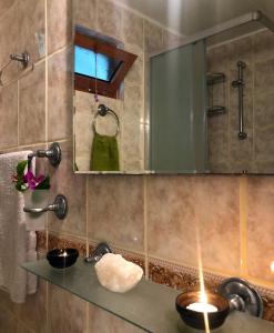 a bathroom with a sink and a mirror at 250m to the Beach - Fully Furnished - Fast Wi-Fi in Marmaris