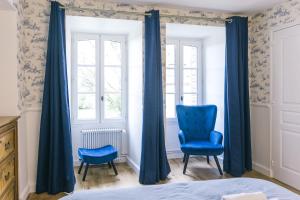 Postel nebo postele na pokoji v ubytování Maison d'hôtes le Prieuré du Preux
