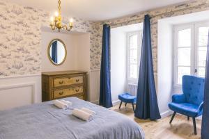 Postel nebo postele na pokoji v ubytování Maison d'hôtes le Prieuré du Preux