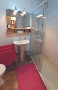 a bathroom with a sink and a toilet and a shower at Quercy Stone Gite Marcilhac in Marcilhac-sur-Célé