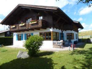 a small house with a balcony on top of it at Ammervital - Apartments in Bad Bayersoien