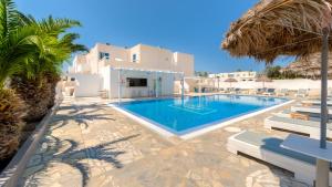 a villa with a swimming pool and a resort at Petit Homme by Andreas in Perissa