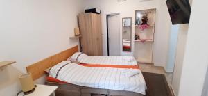 Cama ou camas em um quarto em Java apartments - S & J