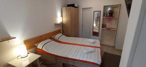 Cama ou camas em um quarto em Java apartments - S & J
