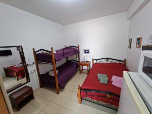 a bedroom with two bunk beds and a mirror at Nicosia rooms Studios in Nicosia