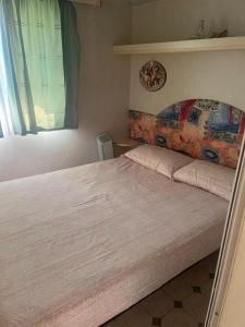 A bed or beds in a room at La casa di Nonn'Anna