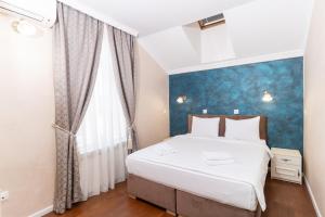 Postel nebo postele na pokoji v ubytování Ornament Hotel + 37 fotografií