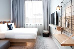 Posteľ alebo postele v izbe v ubytovaní Moxy Vienna City East