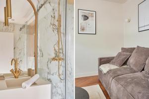 a living room with a couch and a shower at Apart hotel Centre de Paris by Studio prestige in Paris