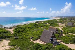 an aerial view of a house on the beach at Singila Ocean Lodge in Inhambane