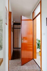 a wooden door in a room with a hallway at Green Point in Preserje