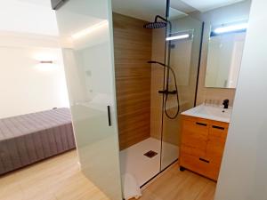 a bathroom with a shower and a sink at Bahia Rooms Cantabria 3000 in Santander