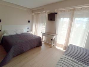 Postel nebo postele na pokoji v ubytování Bahia Rooms Cantabria 3000