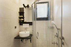 a bathroom with a sink and a shower at Villa Lui Hotel Alaçatı in Ilıca +26 photos