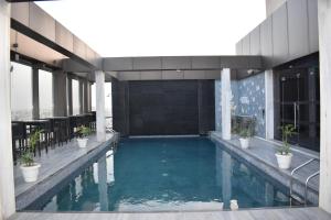 a swimming pool on top of a building at Courtyard by Marriott Amritsar in Amritsar