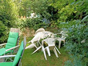 a table and chairs sitting in the grass at L'Angelique in Bouillé-Courdault