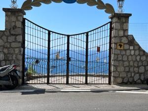 a gate with a view of the ocean behind it at Villa Nannina in Positano