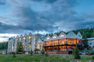 a large hotel building with a lot of windows at Winter Park Mountain Lodge in Winter Park