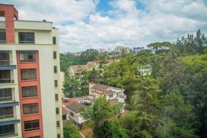 a view of a city with buildings and trees at Serene apartment in the suburbs in Nairobi