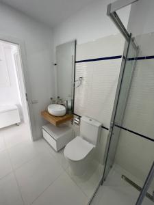 a bathroom with a toilet and a shower and a sink at Oxygen Residence Neptun in Neptun +6 photos