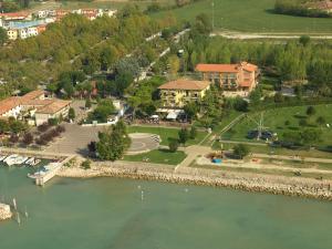 an aerial view of a town next to a river at Hotel Campanello in Castelnuovo del Garda
