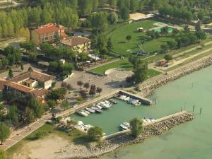 an aerial view of a marina with boats in the water at Hotel Campanello in Castelnuovo del Garda