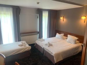 Łóżko lub łóżka w pokoju w obiekcie Hotel Great Polonia Conrad Kraków