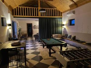 a living room with a pool table in the middle at BURDANÓWKA CAMINO in Krasnystaw