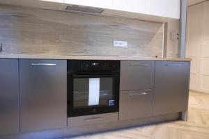 A cozinha ou cozinha compacta de Sniego Apartments