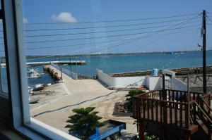 a view of the water from a balcony of a harbor at See Starsea Guest House in Magong