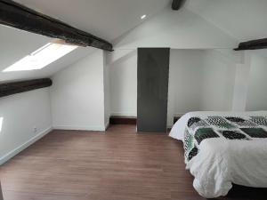 a bedroom with a bed and a wooden floor at home, sweet home in Vitry-sur-Seine
