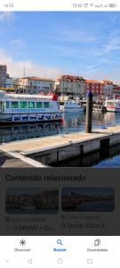 a picture of boats docked at a marina at Aires do mar in O Grove