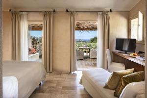A television and/or entertainment centre at Petra Segreta Resort & Spa