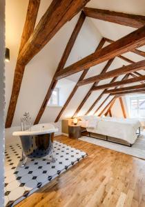 Postel nebo postele na pokoji v ubytování Domus Balthasar Boutique Hotel