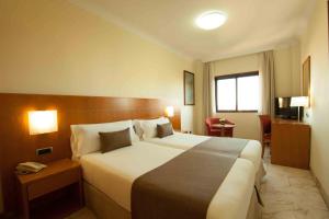 Кровать или кровати в номере Hotel Principe Paz