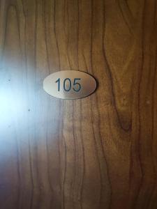 a sign on a wooden door with the number on it at Apartmány GUGEL MLYNKY in Mlynky 