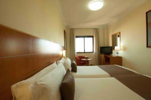 Кровать или кровати в номере Hotel Principe Paz