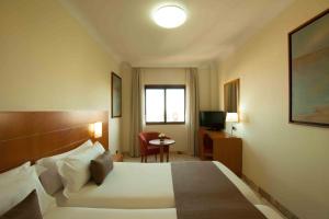 Кровать или кровати в номере Hotel Principe Paz