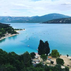 a view of a lake with boats in the water at studio meublé classé 2 étoiles - 30m² in Gréoux-les-Bains