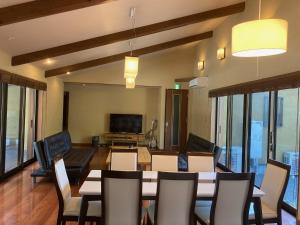 a dining room with a table and chairs at YUFUIN YUKI-AN in Yufuin