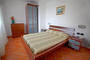 Łóżko lub łóżka w pokoju w obiekcie Residence Villa Andrea