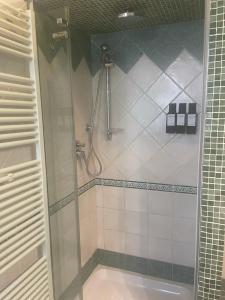 a shower with a glass door in a bathroom at Casa Antonella in Rome