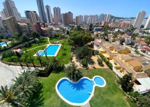 an aerial view of a resort with a swimming pool at Cozy apartment Benidorm Poniente 5 min from the beach in Benidorm