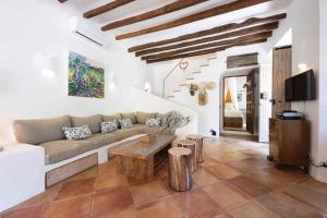 a living room with a couch and a table at CA'N LA in Deia