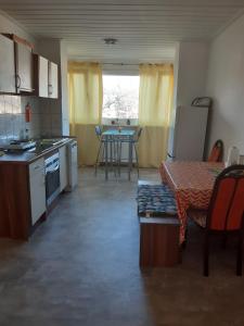 a small kitchen with a table and a table sidx sidx sidx at worker-flat in Gelsenkirchen