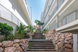 a set of stairs leading up to a building at 3 Bedroom sea view Stupa Hills in Benalmádena