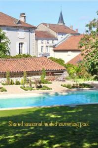 lished seasonal heated swimming pool in a residential estate at La Pêche in Piégut-Pluviers