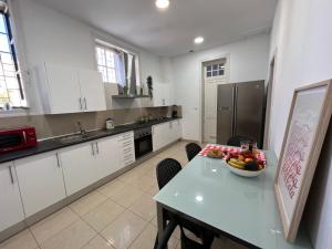 Kuchyň nebo kuchyňský kout v ubytování CoLiving Villa Brasil